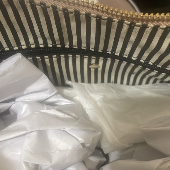 Pre-loved Kate Spade shoulder bag. Colors are fawn and black with gold accents. - Picture 6 of 9